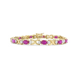 14K Yellow Gold 1/4 Cttw Diamond and Oval Red Ruby Alternating X Link Bracelet (I-J Color, I3 Clarity)