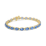 10K Yellow Gold and 4 Prong Set 6X4 MM Blue Topaz Link Tennis Bracelet - Size 7 Inches